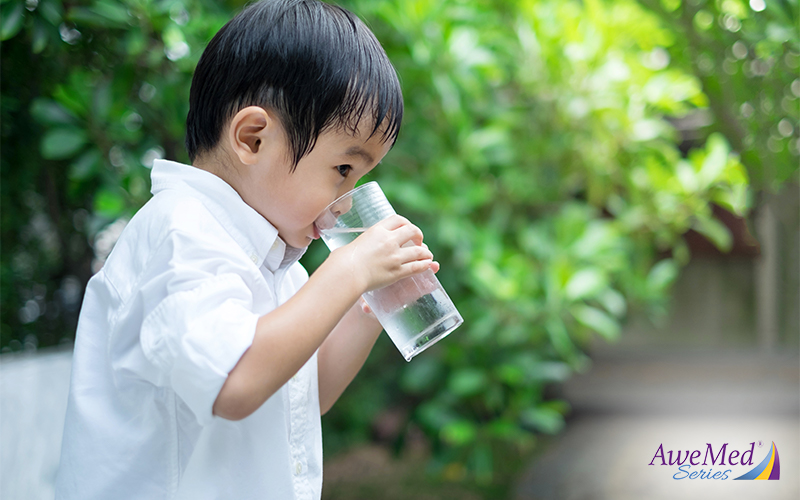 A Child Drinking Water