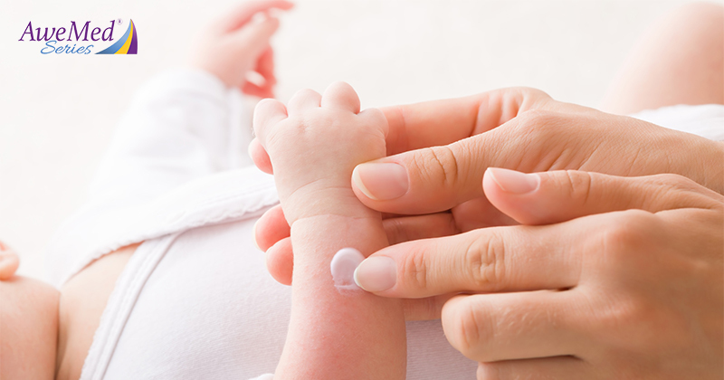 Applying lotion on a baby's arm