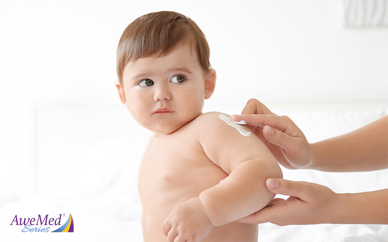 Parent Applying Moisturizer on Child's Arm
